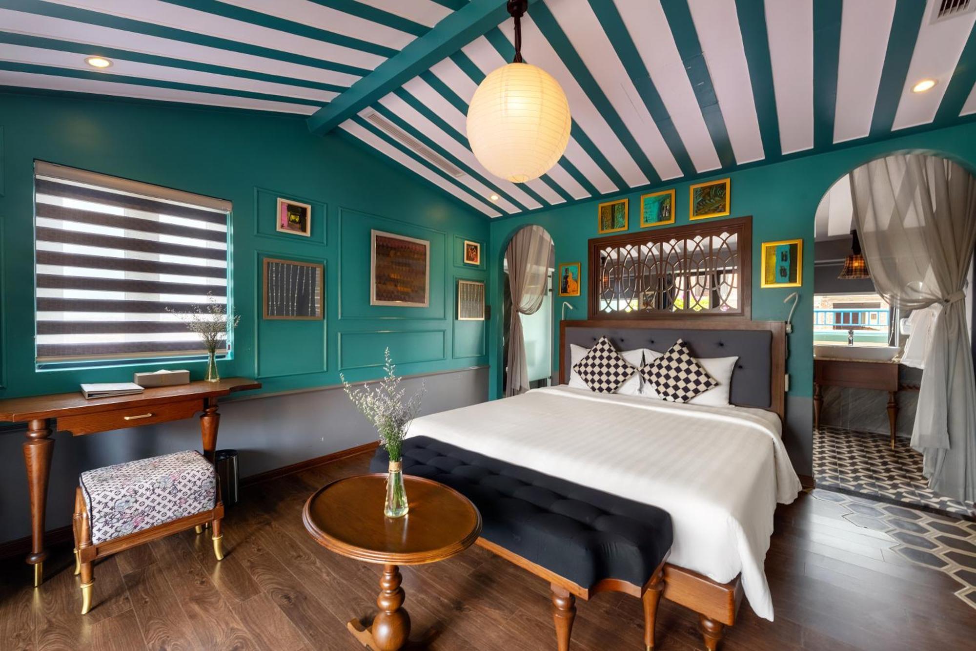 Son Hoi An Boutique Hotel & Spa Exterior foto A bedroom at the hotel